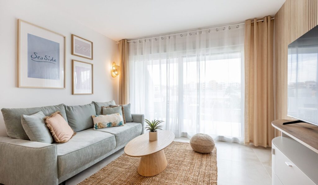 Sea Side Punta Prima — Living room with sofa