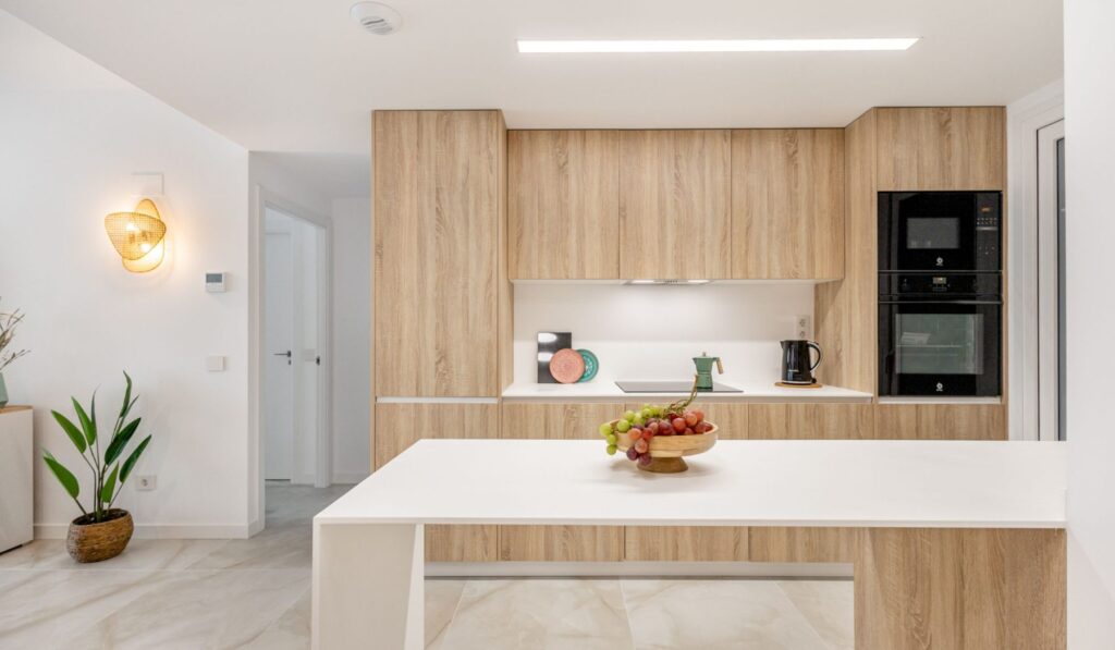 Sea Side Punta Prima — Open kitchen with breakfast bar