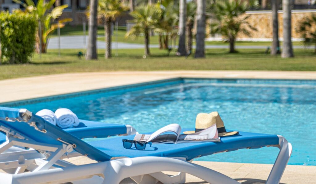 Sea View Playa Flamenca — Sun loungers by the community pool